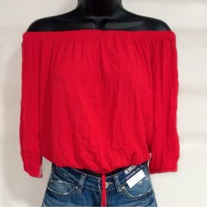 Women’s red off shoulder blouse with string tie front. Size S
